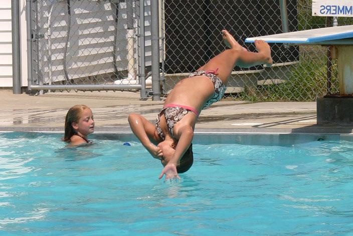 diving into an outdoor pool